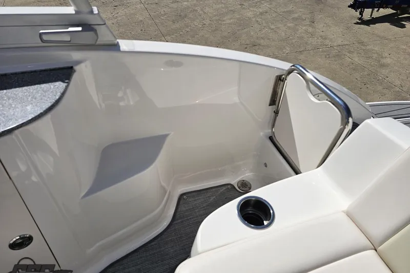 Slide: The Image of Interior view of 2016 Chaparral 244 Sunesta boat, featuring seating and cup holder. - 115
