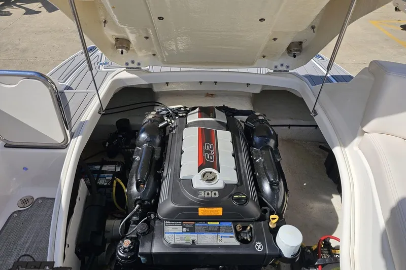 Slide: The Image of 2016 Chaparral 244 Sunesta boat engine compartment with open hatch. - 119