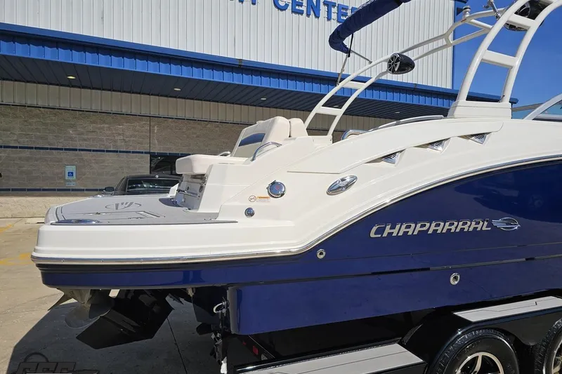 Slide: The Image of 2016 Chaparral 244 Sunesta boat displayed outside a marine center. - 12