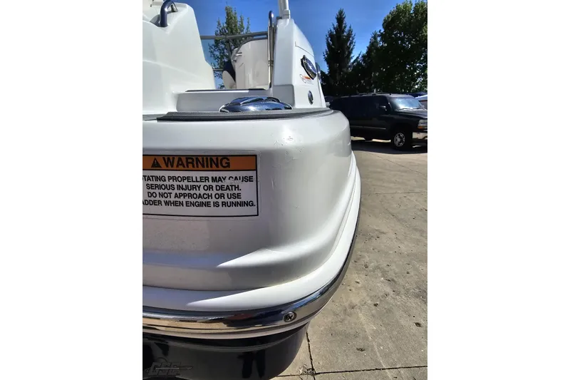Slide: The Image of 2016 Chaparral 244 Sunesta boat stern with safety warning label. - 39