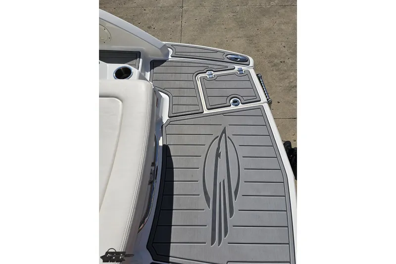Slide: The Image of 2016 Chaparral 244 Sunesta boat deck with gray non-slip surface and seating area. - 43