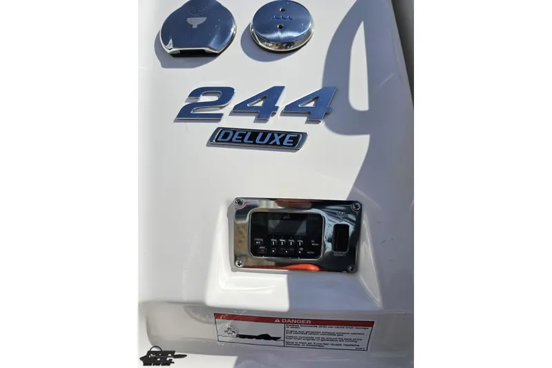 Slide: The Image of 2016 Chaparral 244 Sunesta Deluxe boat dashboard with control panel and branding. - 45