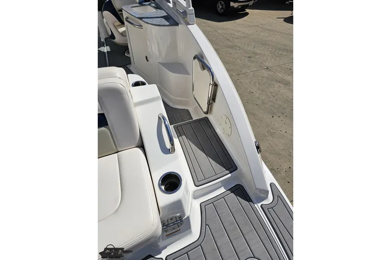 Slide: The Image of 2016 Chaparral 244 Sunesta boat interior with seating and cup holders. - 51