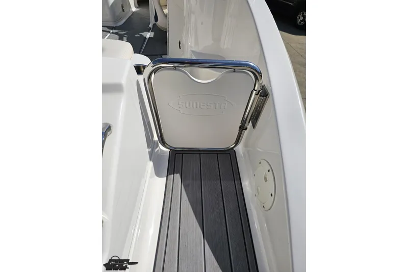 Slide: The Image of 2016 Chaparral 244 Sunesta boat deck with Sunesta-branded gate and sleek flooring. - 52
