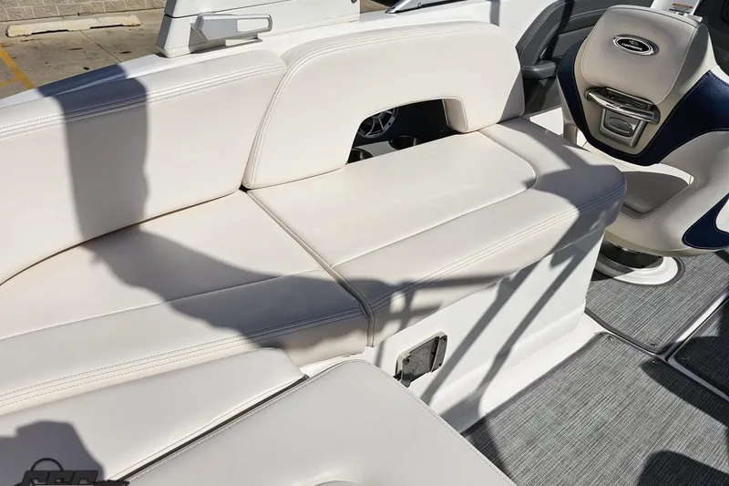 Slide: The Image of 2016 Chaparral 244 Sunesta boat interior with white seating and modern design. - 59