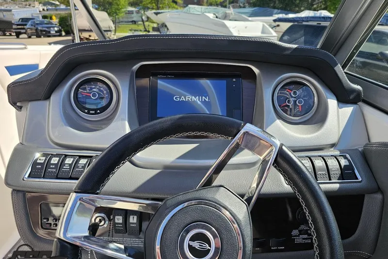 Slide: The Image of Dashboard of a 2016 Chaparral 244 Sunesta boat with Garmin navigation system. - 68