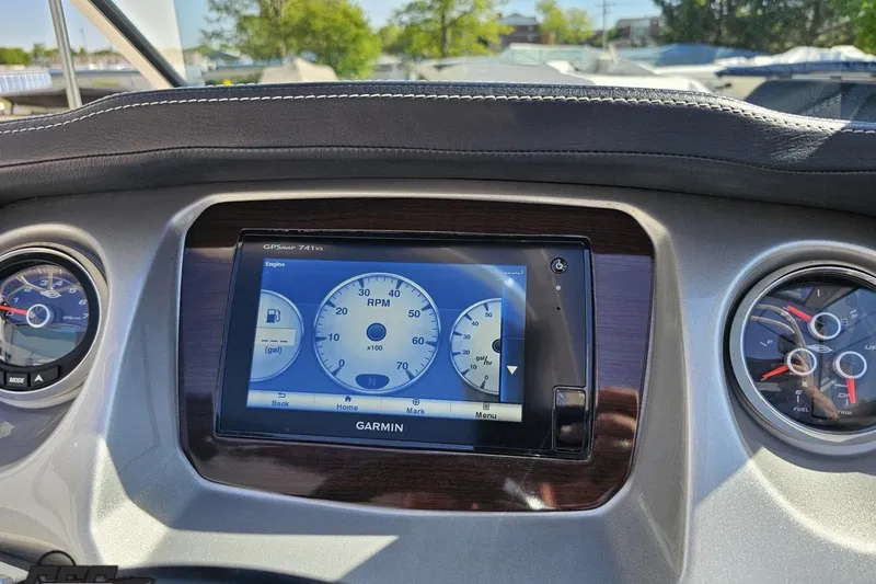 Slide: The Image of Dashboard of a 2016 Chaparral 244 Sunesta boat featuring Garmin GPS and gauges. - 70