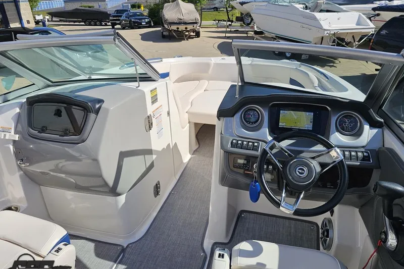 Slide: The Image of Interior view of 2016 Chaparral 244 Sunesta boat with modern dashboard and seating. - 77