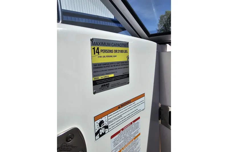 Slide: The Image of 2016 Chaparral 244 Sunesta capacity plate, maximum 14 persons or 2100 lbs. - 83