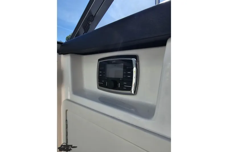 Slide: The Image of Control panel on 2016 Chaparral 244 Sunesta boat dashboard, featuring sleek design and modern interface. - 84