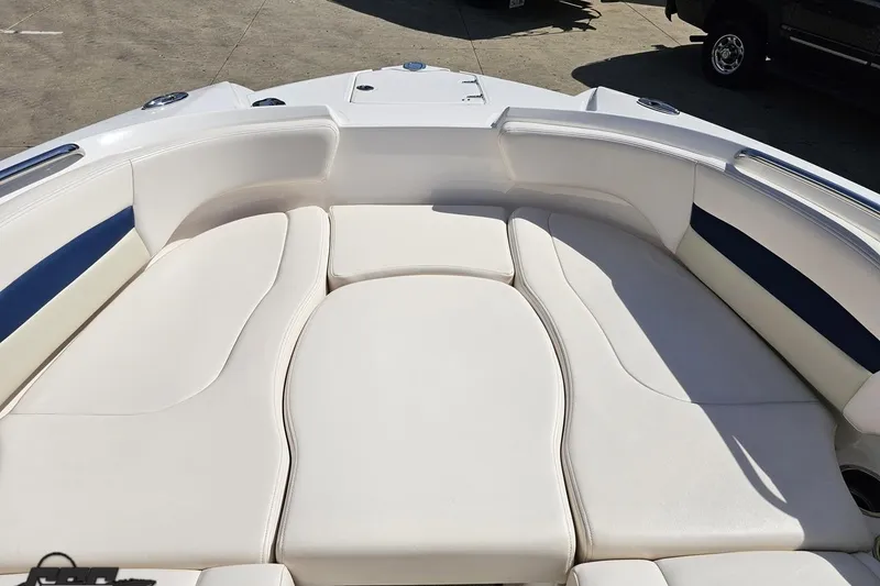 Slide: The Image of 2016 Chaparral 244 Sunesta boat interior with white cushioned seating. - 87