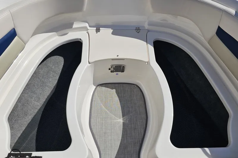 Slide: The Image of Interior view of 2016 Chaparral 244 Sunesta boat, featuring storage compartments. - 98