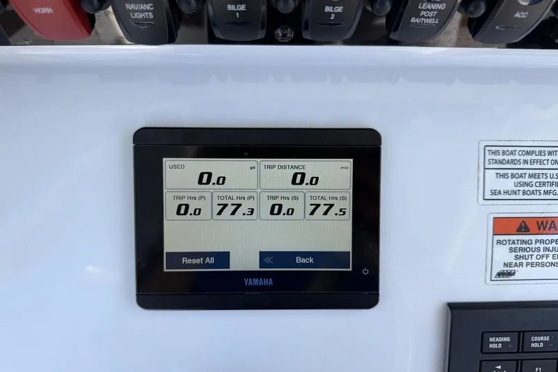 Slide: The Image of Yamaha display on 2024 Sea Hunt Ultra 265 SE boat dashboard showing trip data. - 10