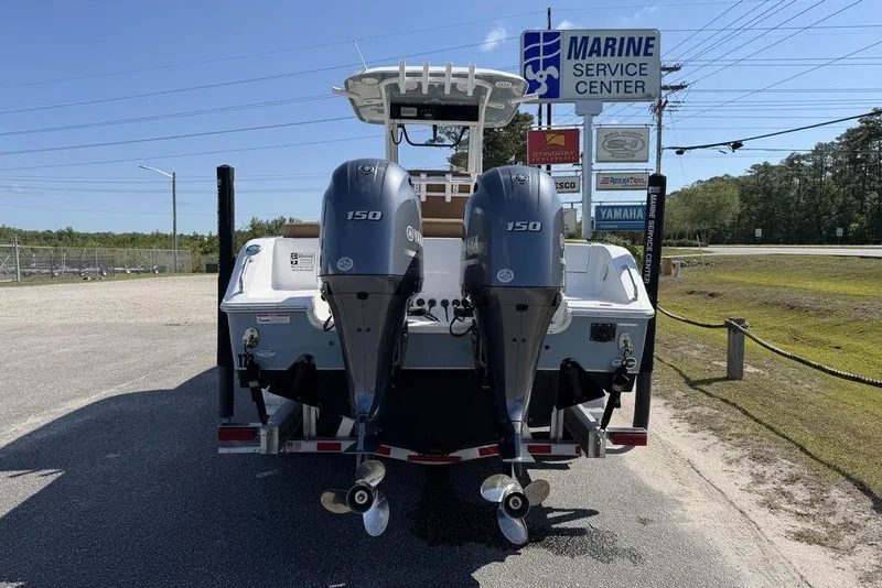 Slide: The Image of 2024 Sea Hunt Ultra 265 SE boat with dual Yamaha 150 engines at Marine Service Center. - 11