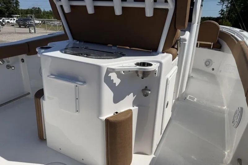 Slide: The Image of 2024 Sea Hunt Ultra 265 SE boat interior with seating and storage compartments. - 20
