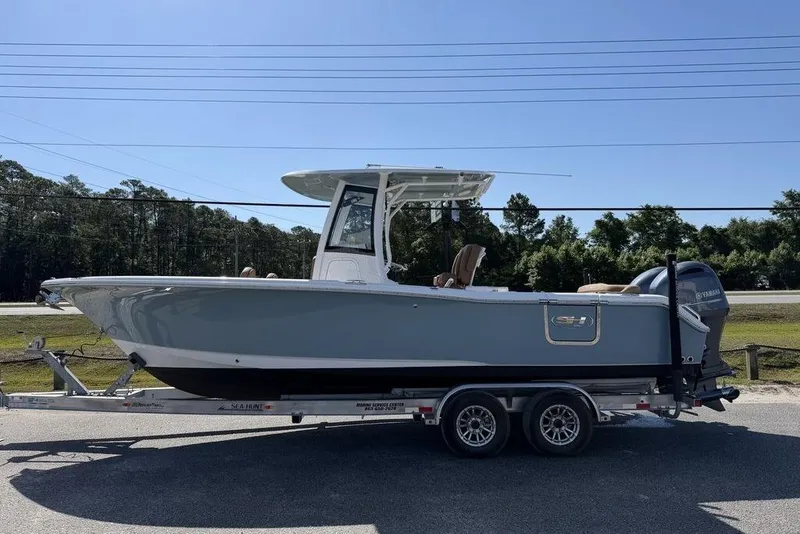 Slide: The Image of 2024 Sea Hunt Ultra 265 SE boat on trailer, side view, outdoors. - 26