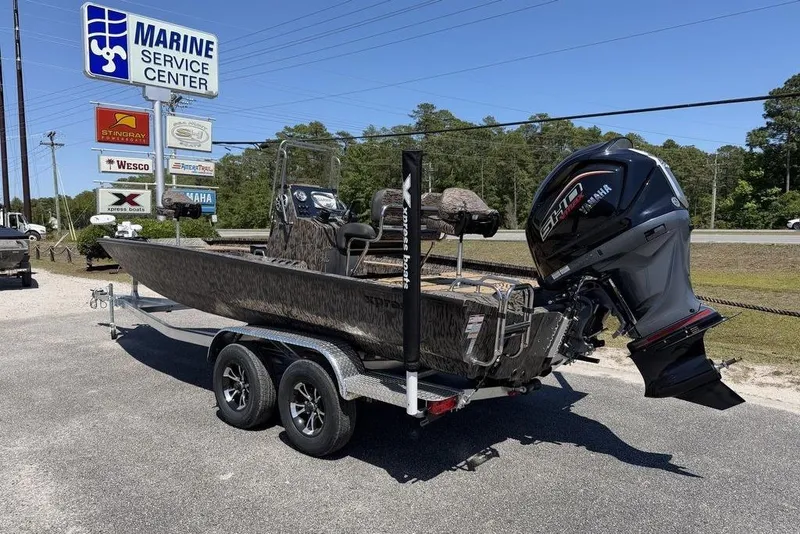Slide: The Image of 2026 Xpress H22B Bay boat on trailer at Marine Service Center. - 5