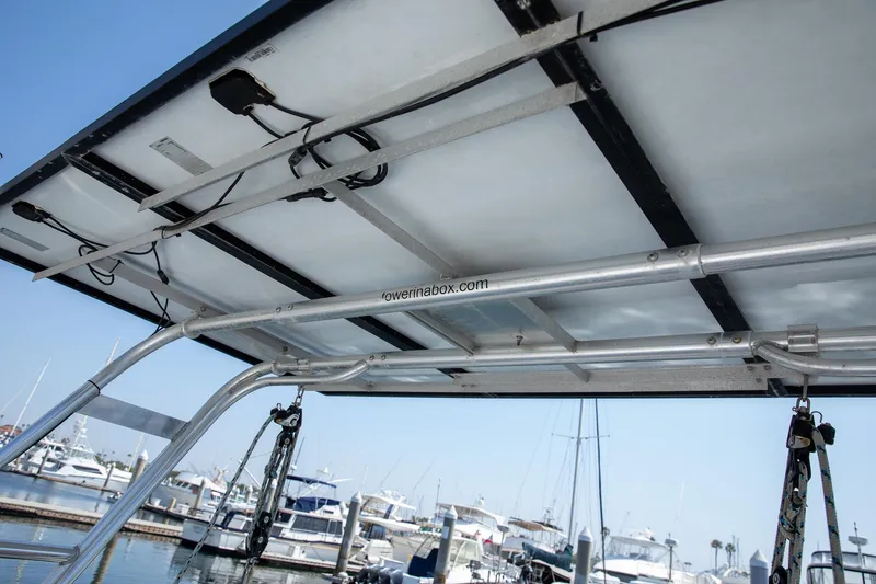 Slide: The Image of Solar panels on a 1994 Morgan Catalina 38 sailboat, docked at a marina. - 13