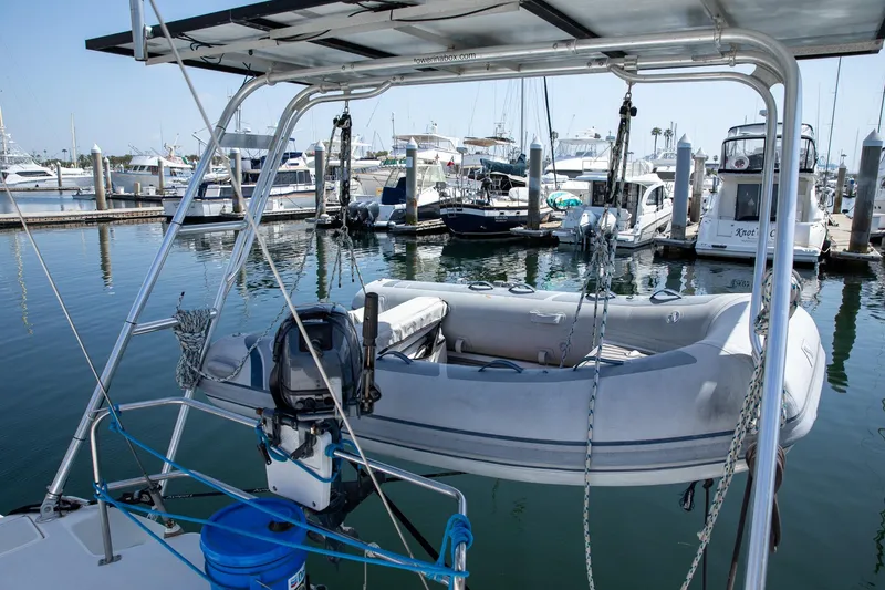 Slide: The Image of Inflatable dinghy on a 1994 Morgan Catalina 38 sailboat at a marina. - 14