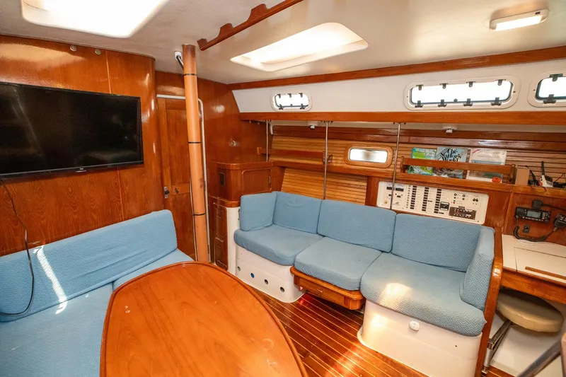 Slide: The Image of Interior of 1994 Morgan Catalina 38 yacht kitchen with stove, microwave, and wooden cabinetry. - 26