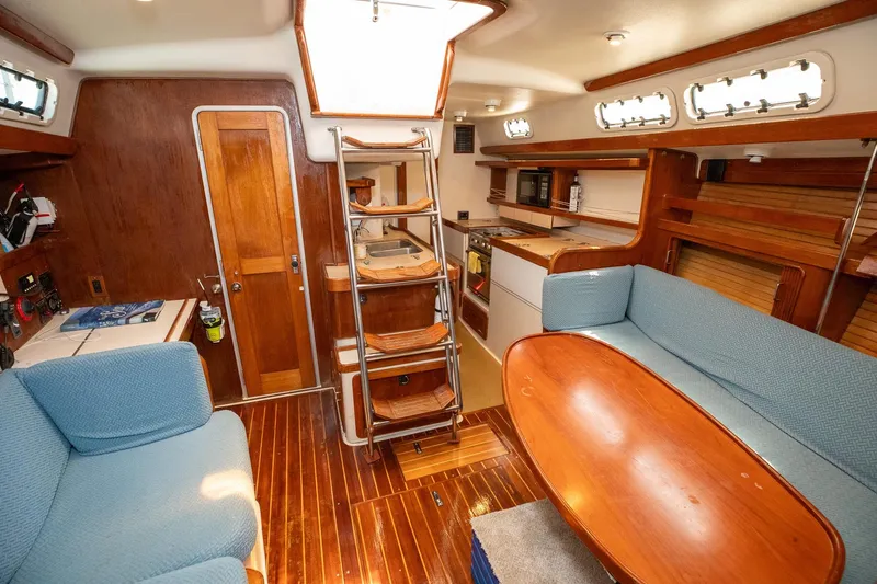 Slide: The Image of Interior of 1994 Morgan Catalina 38 yacht kitchen with wooden cabinetry and modern appliances. - 27