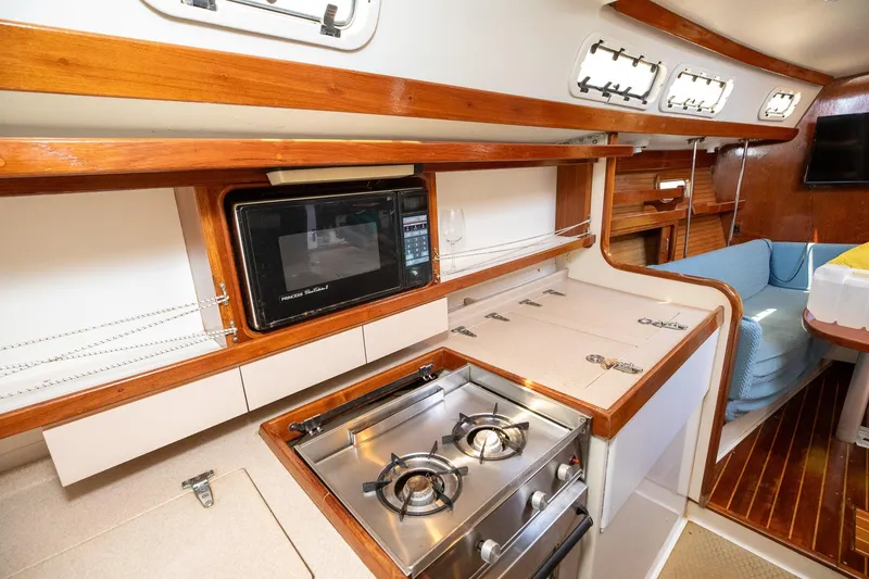 Slide: The Image of Navigation station on a 1994 Morgan Catalina 38 sailboat with communication equipment. - 32