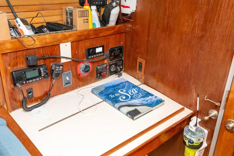 Slide: The Image of Cozy cabin interior of 1994 Morgan Catalina 38 sailboat with wooden finishes and yellow bedding. - 36