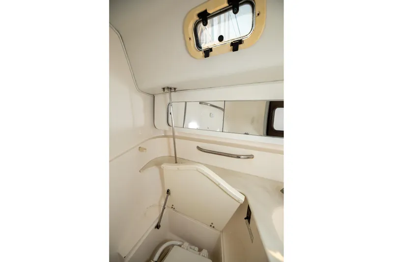 Slide: The Image of Cozy cabin interior of 1994 Morgan Catalina 38 with yellow bedding and nautical-themed blanket. - 43