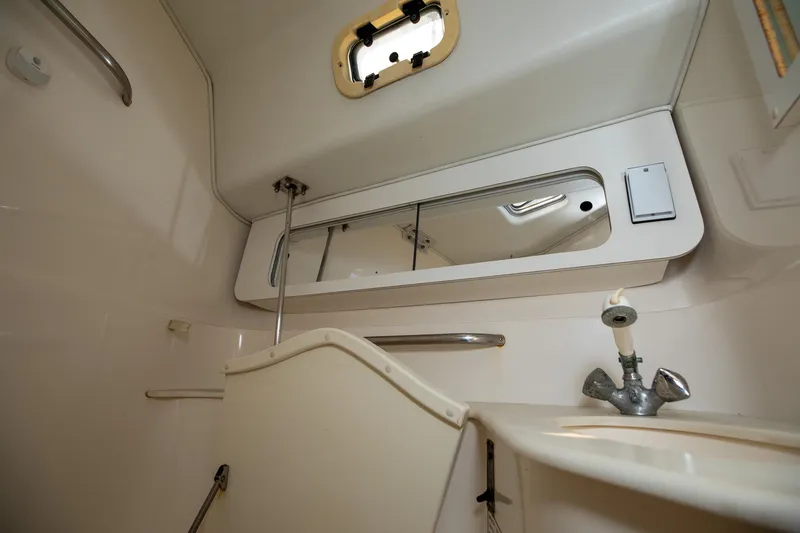 Slide: The Image of Cozy cabin interior of 1994 Morgan Catalina 38 with yellow bedding and nautical-themed blanket. - 44