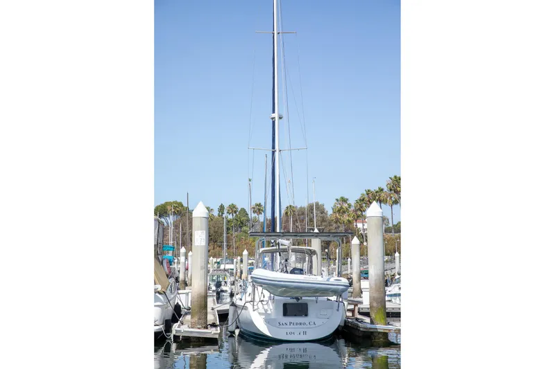 Slide: The Image of Sailboat Morgan Catalina 38, 1994 model, docked in a marina with clear blue sky. - 5