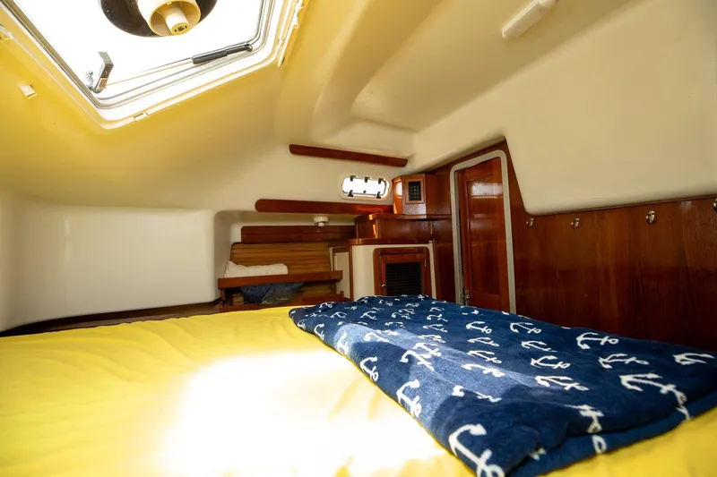 Slide: The Image of Compact bathroom in a 1994 Morgan Catalina 38 yacht, featuring sink and toilet. - 53