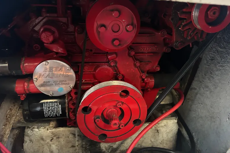Slide: The Image of Red Beta Marine engine in a 1994 Morgan 38 sailboat, showcasing mechanical components. - 60