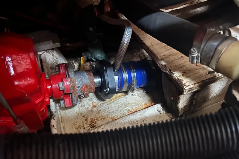 Slide: The Image of Engine compartment of a 1994 Morgan 38, featuring red and blue mechanical components. - 61