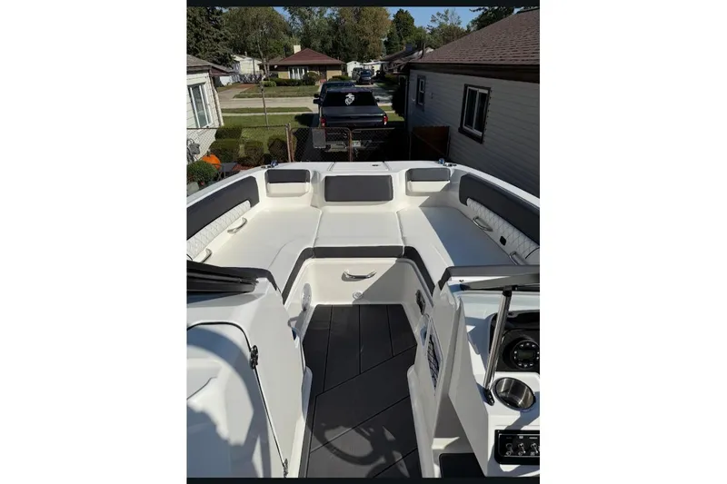 Slide: The Image of 2023 Bayliner DX 2250 boat interior with spacious seating and modern design. - 12
