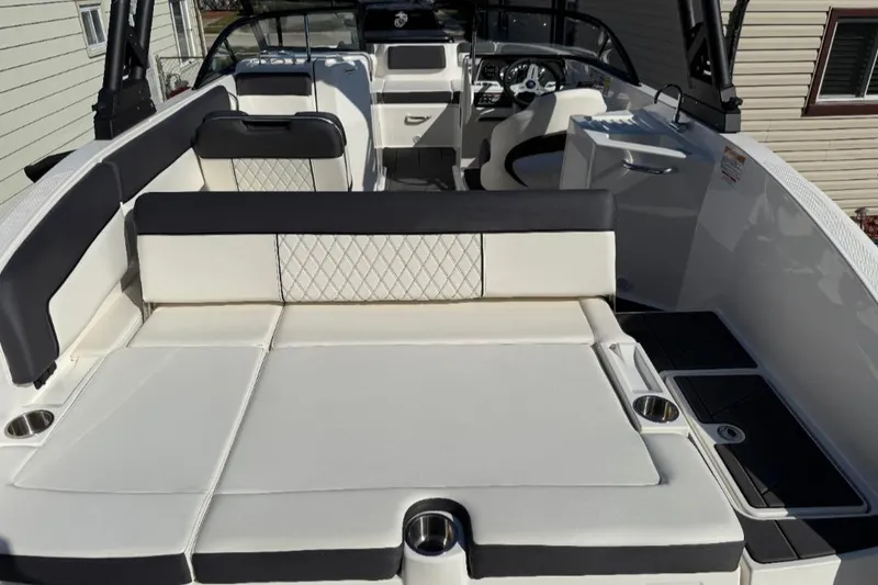 Slide: The Image of 2023 Bayliner DX 2250 boat interior with spacious seating and modern design. - 15
