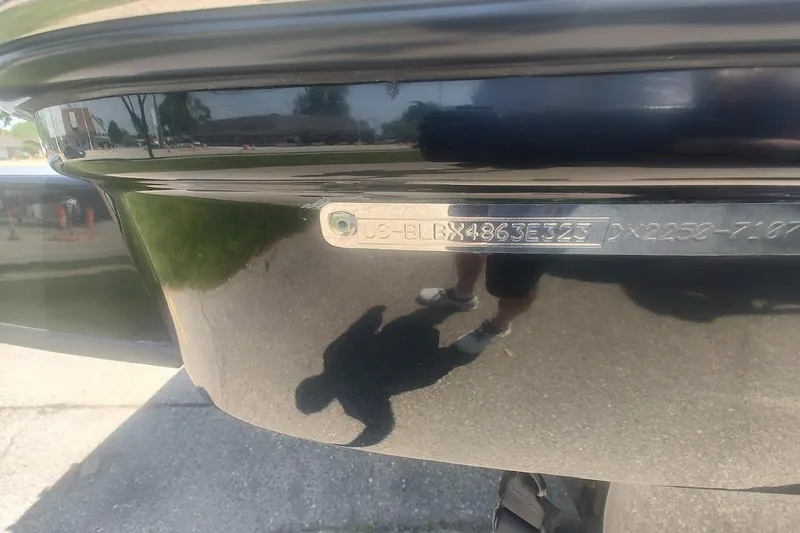 Slide: The Image of 2023 Bayliner DX 2250 boat identification plate with reflection on shiny surface. - 16