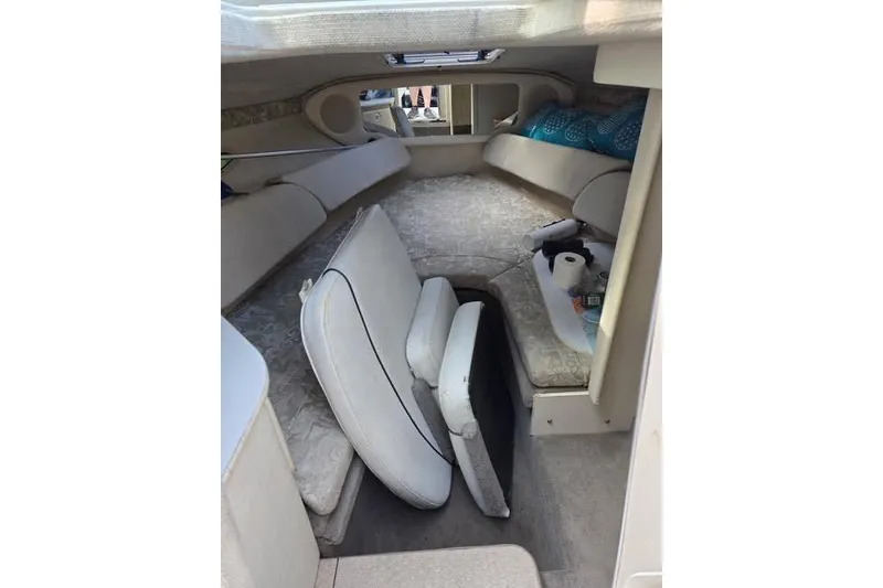Slide: The Image of Interior cabin of 2004 Sea Ray 215 Weekender boat with seating and storage. - 6