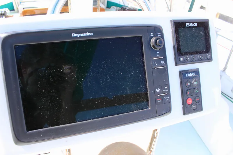 Slide: The Image of Navigation equipment on a 1975 Downeast 38 sailboat, featuring Raymarine and B&G displays. - 22