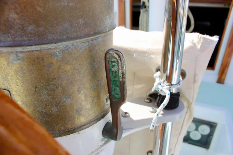 Slide: The Image of Close-up of a 1975 Downeast 38 boat's fuel lever and brass components. - 24