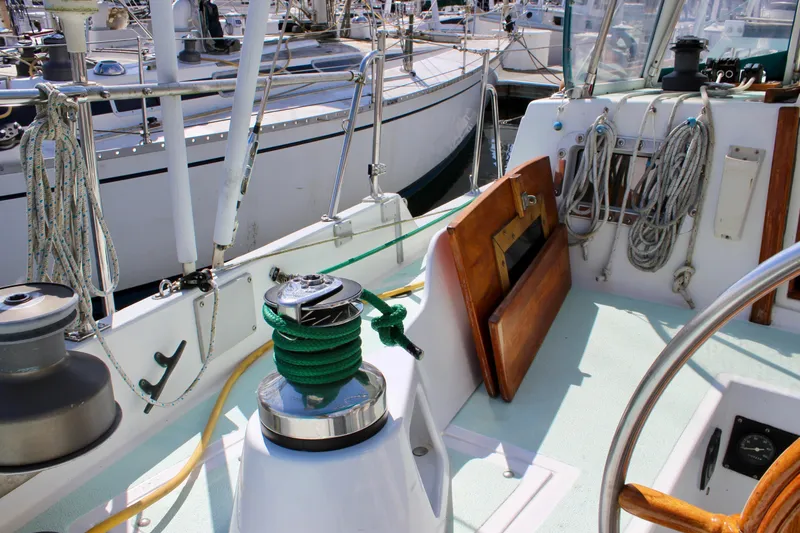 Slide: The Image of Cockpit of a 1975 Downeast 38 sailboat with winches and ropes. - 25