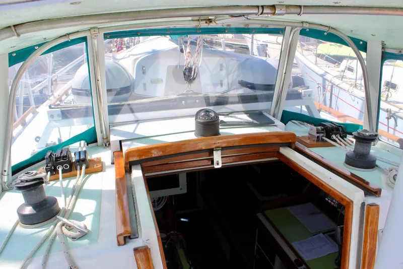 Slide: The Image of Cockpit view of a 1975 Downeast 38 sailboat with winches and navigation equipment. - 26
