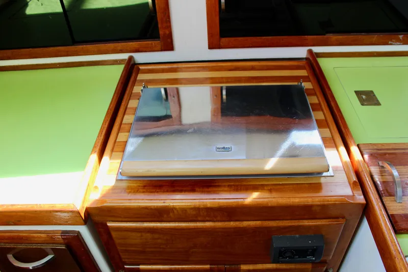 Slide: The Image of 1975 Downeast 38 yacht interior with wooden cabinetry and stainless steel appliance. - 35