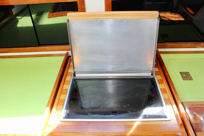 Slide: The Image of 1975 Downeast 38 yacht kitchen with a closed stainless steel stove cover. - 36