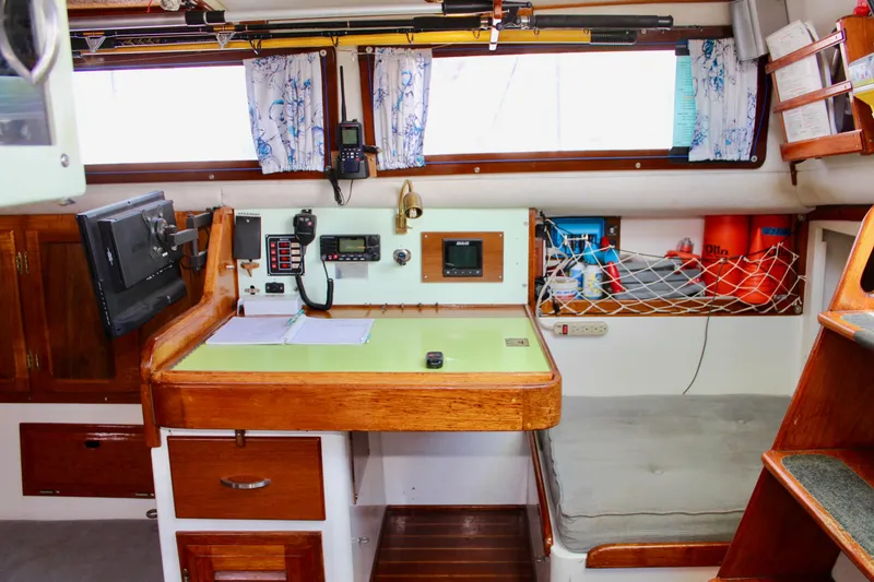 Slide: The Image of Interior of a 1975 Downeast 38 sailboat with navigation station and equipment. - 39