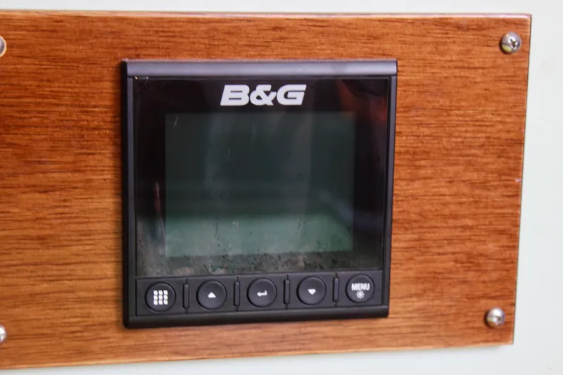 Slide: The Image of B&G marine display on 1975 Downeast 38 yacht, mounted on wooden panel. - 42