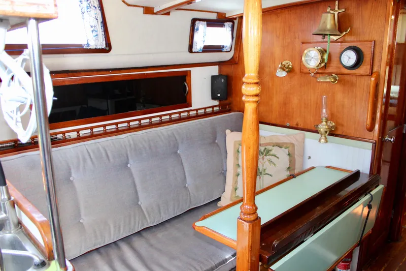 Slide: The Image of Interior of a 1975 Downeast 38 sailboat with wooden accents and nautical decor. - 50