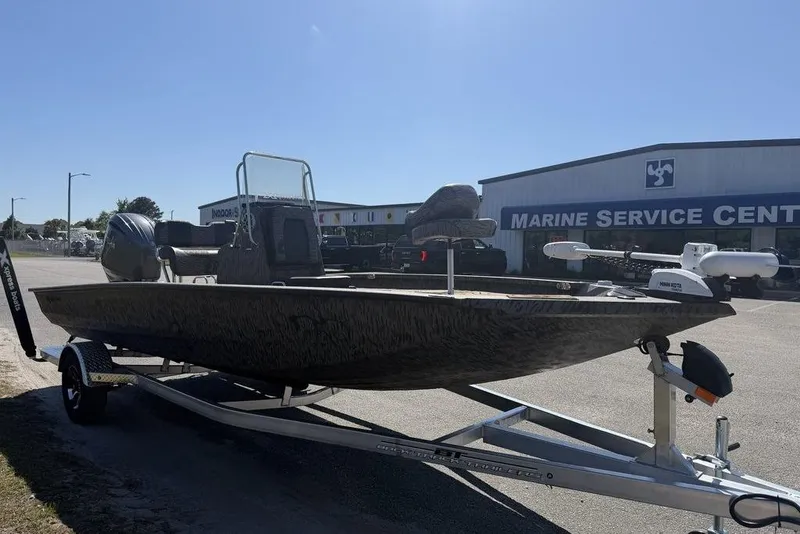 Slide: The Image of 2026 Xpress H22B Bay boat on trailer outside Marine Service Center. - 4