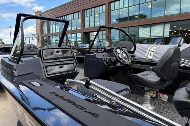 Slide: The Image of 2025 Tracker Targa V-19 WT Tournament Edition boat interior with modern dashboard and seating. - 4