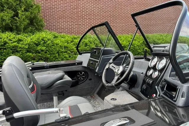 Slide: The Image of 2025 Tracker Targa V-19 WT Tournament Edition boat interior with steering wheel and dashboard. - 7