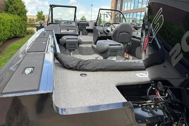 Slide: The Image of 2025 Tracker Targa V-19 WT Tournament Edition boat interior with seating and controls. - 8